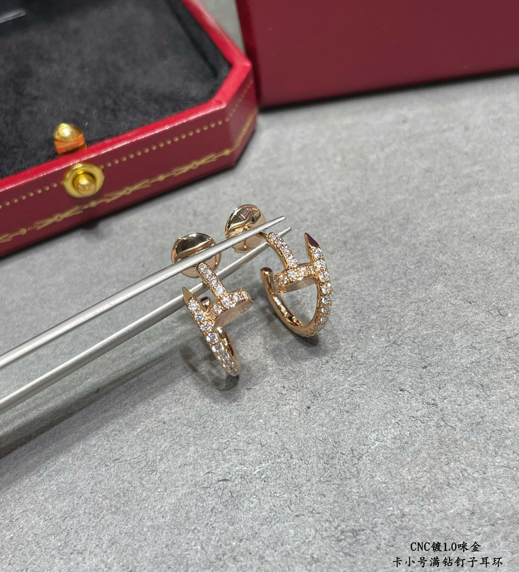 ca*t*er fully Di*m*nd-encrusted small nail earrings