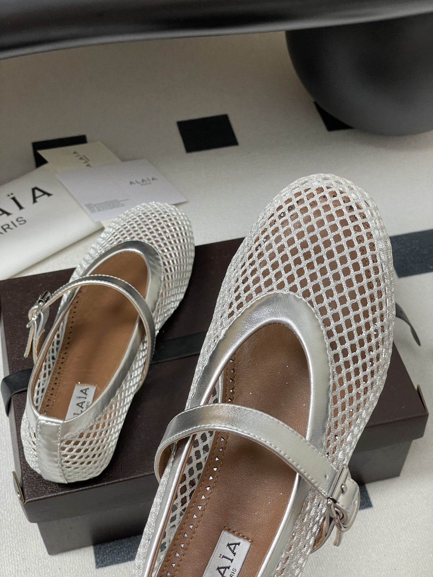 UA ALAÏA BALLET FLATS IN FISHNET