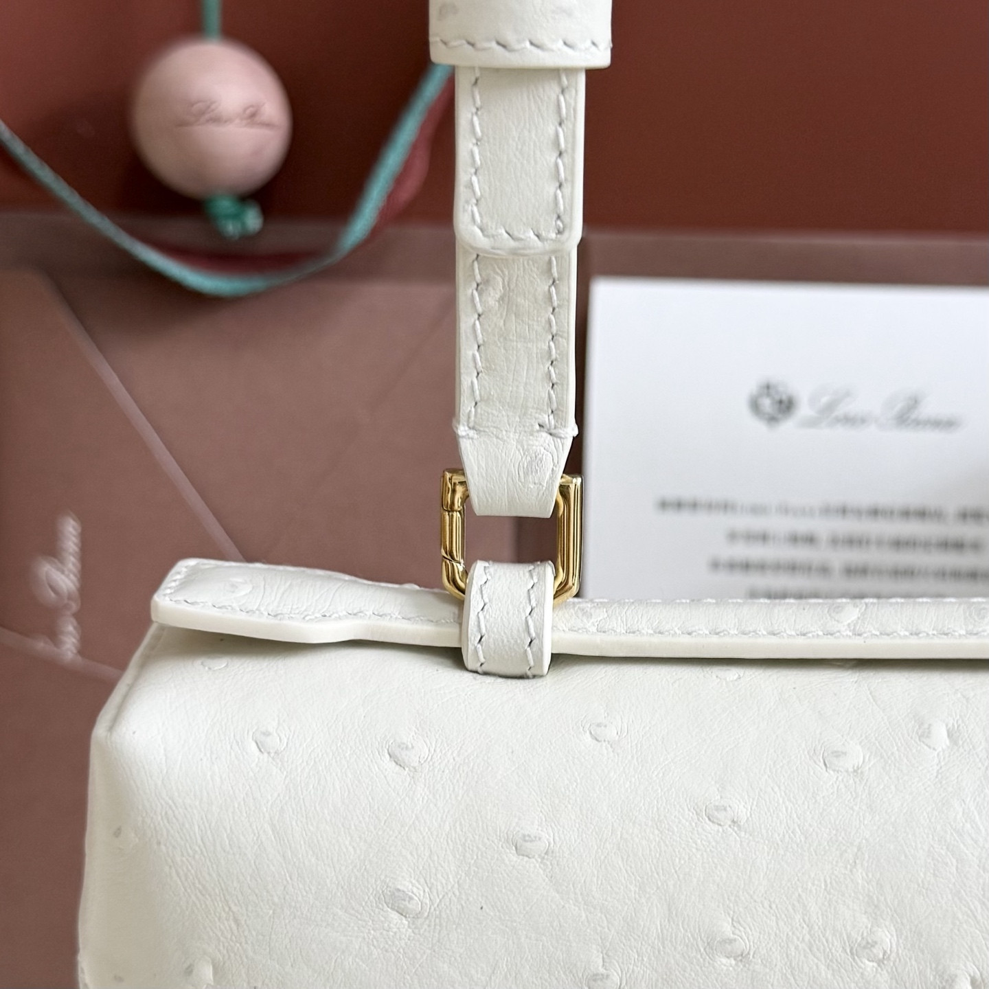 L**o p*ana extra pocket l27 ostrich-grained leather 16x27x10cm