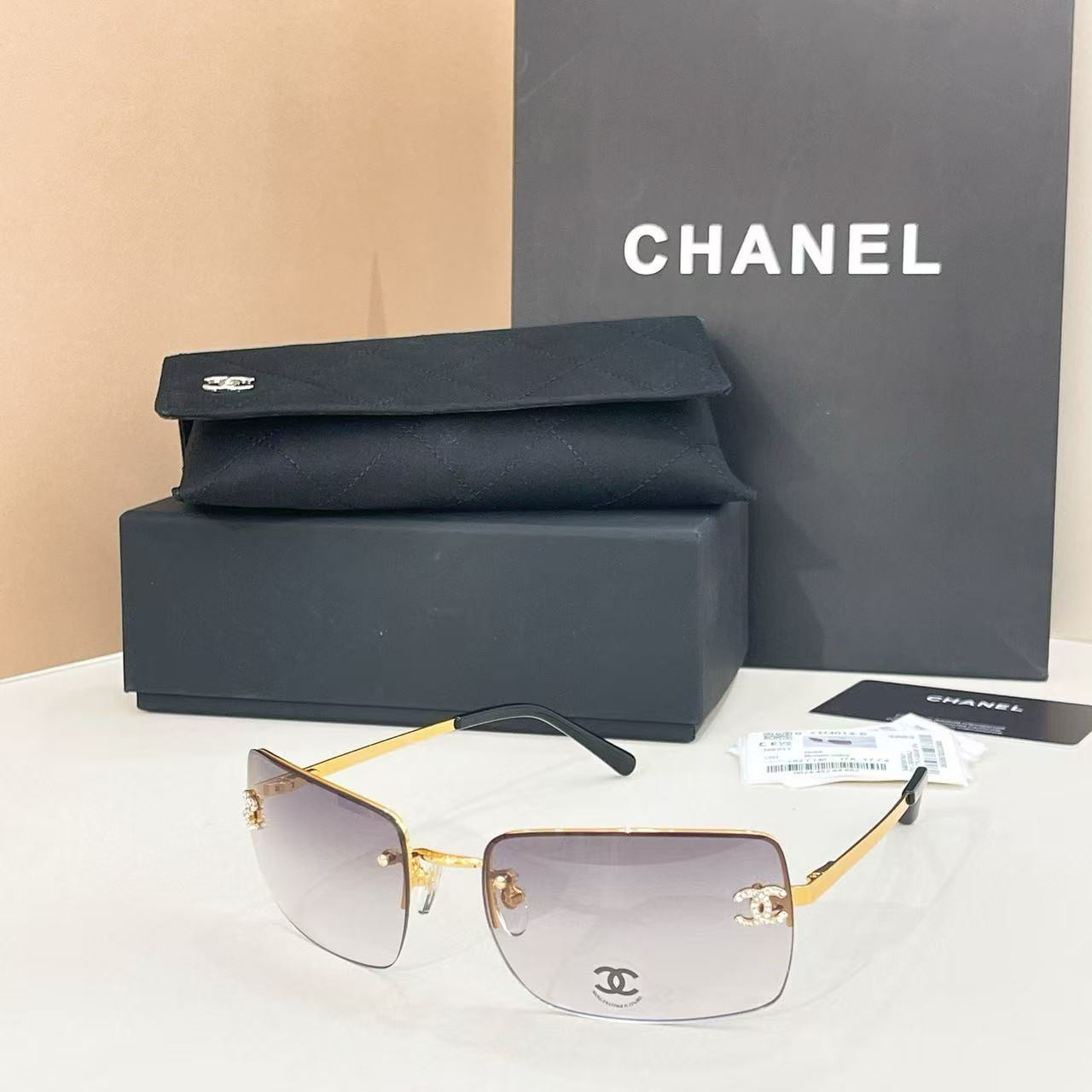 Ch**el crystal logo glasses